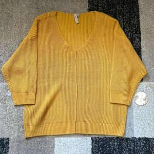 Slightly oversized mustard colored light sweater